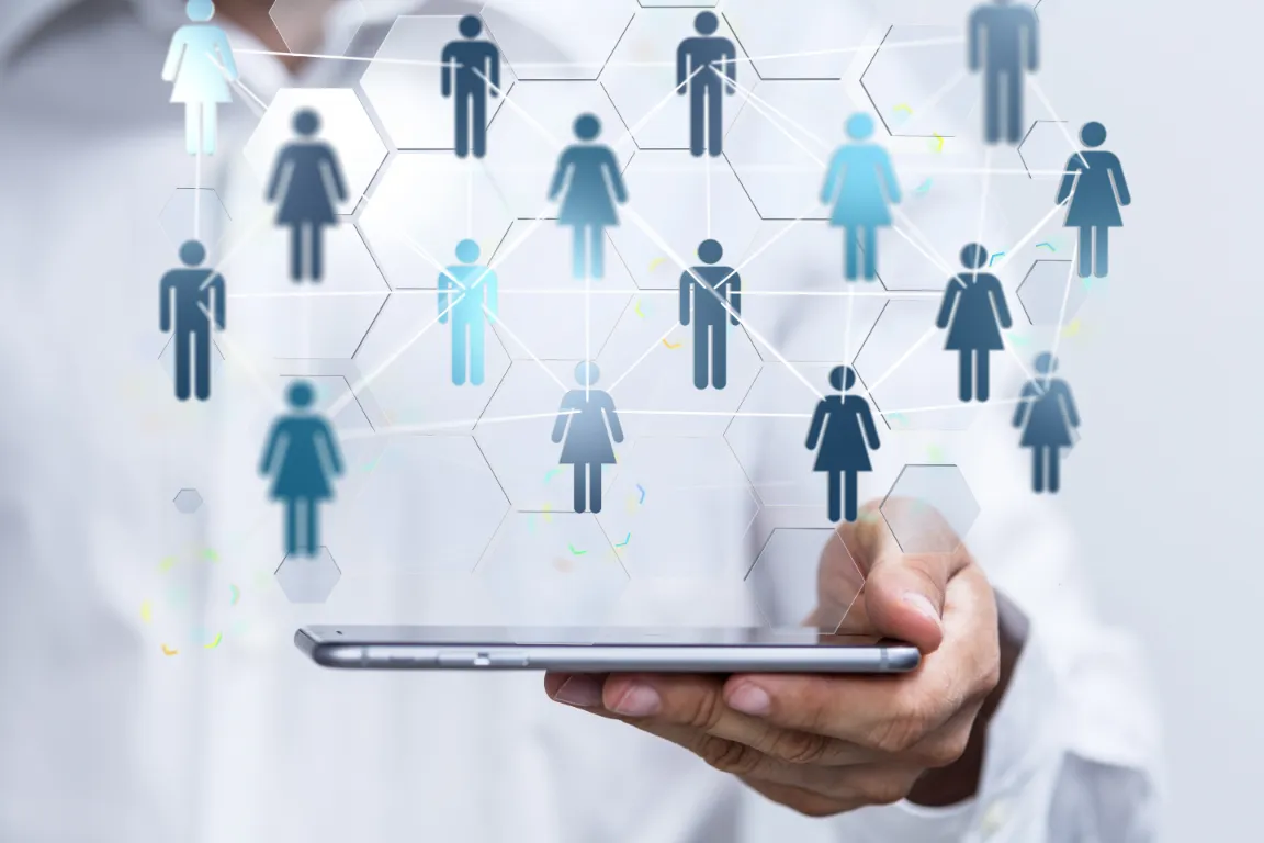 doctor holding phone with holographic avatars floating above it doctor holding phone with holographic avatars floating above it