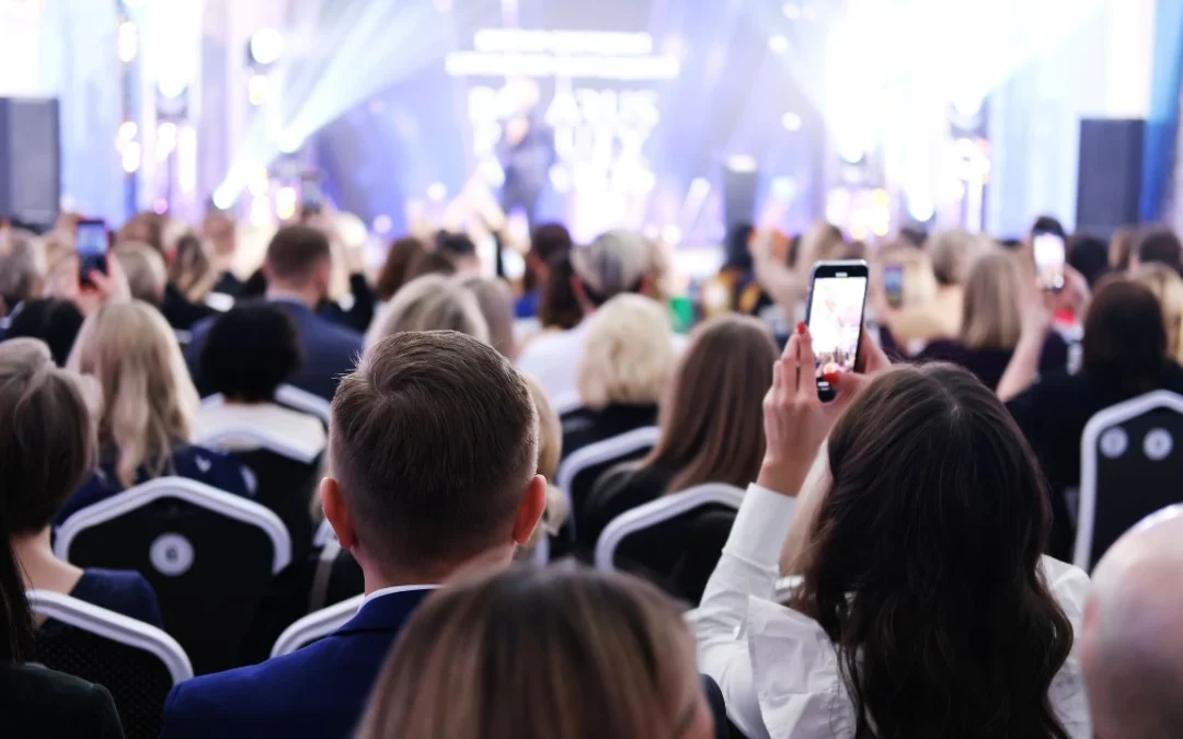 Girl filming an event on the phone